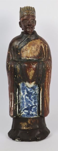 null CHINA.

Statuette of a standing dignitary in porcelain, partially enamelled...
