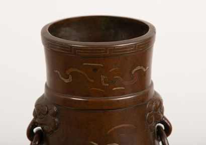 null INDOCHINA, 19th century.

Bronze vase with niello decoration of characters,...