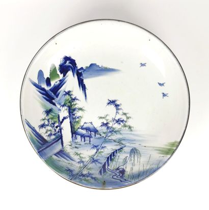 null CHINA, 20th century.

Important circular dish in white, blue and green enamelled...