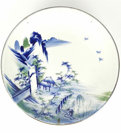 null CHINA, 20th century.

Important circular dish in white, blue and green enamelled...