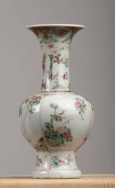 null CHINA, 18th century.

Porcelain vase and polychrome enamels in reserves of birds,...