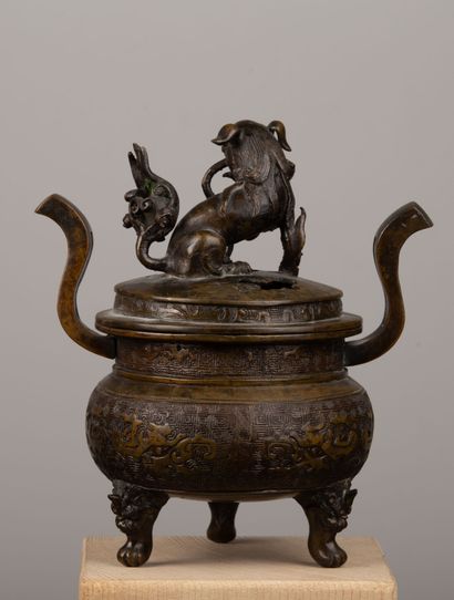 null SOUTH CHINA.

An archaic bronze incense burner with a shaded brown patina, the...