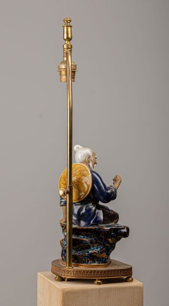 null CHINA.

Subject representing a fisherman in enamelled stoneware.

The lamp mount...