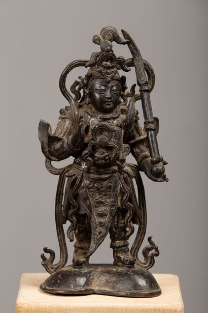 null CHINA or TIBET.

Statuette in bronze with brown patina representing Kubera (?)...