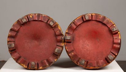 null SOUTHEAST ASIA.

Pair of richly carved wooden saddles, lacquered orange.

The...
