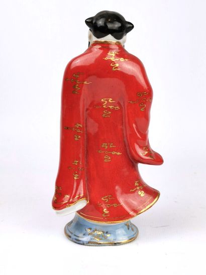 null CHINA, 20th century. 

Porcelain statuette enamelled polychrome and gold representing...