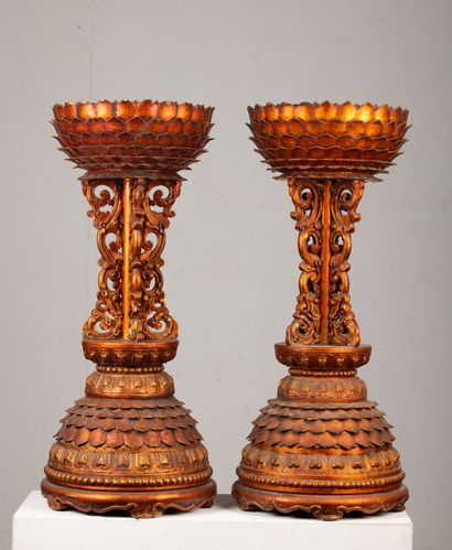 null SOUTHEAST ASIA.

Pair of richly carved wooden saddles, lacquered orange.

The...