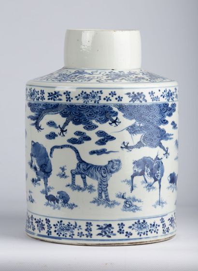null CHINA, 19th century.

A flat-bottomed porcelain and white-blue enamel vase richly...