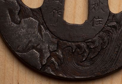 null JAPAN, 19th century.

Tsuba in patinated iron with chiseled decoration in relief...
