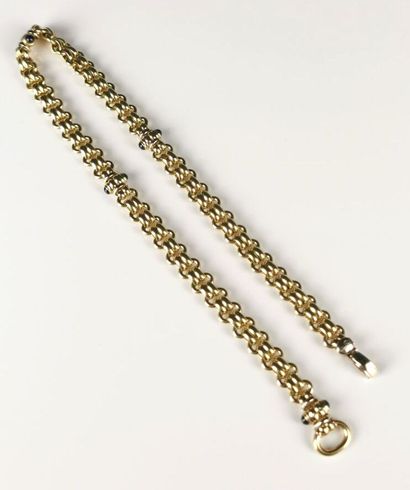 null Important collier en or jaune orné de cabochons de pierre.

L_ 45.6 cm

Poids...