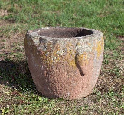 null Mortar in pink sandstone with archaic man's head decoration.

Probably from...
