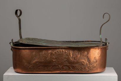 null Large copper with fish embossed with a coat of arms supported by two dragons...