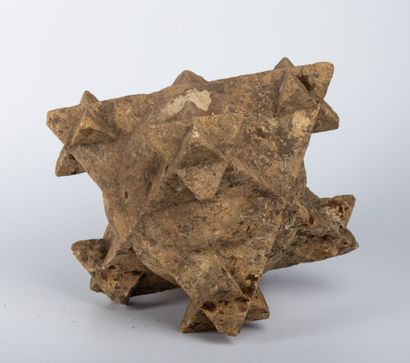null Carved stone polyhedron, with seven elements representing small polyhedrons....