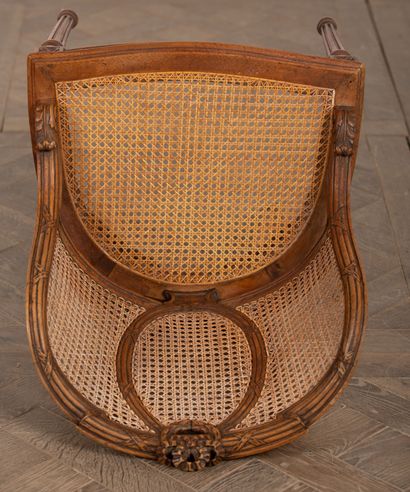 null Caned armchair, the back with medallion and ribbon bow.

Louis XVI style, circa...