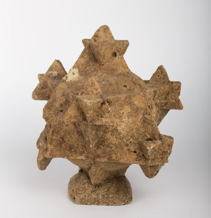 null Carved stone polyhedron, with seven elements representing small polyhedrons....