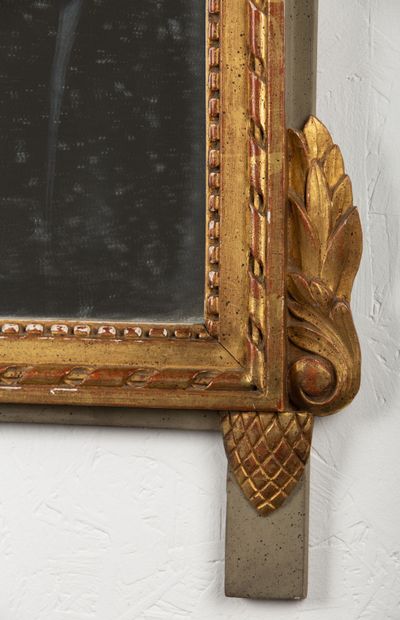 null Carved, lacquered and gilded wood mirror, the pediment decorated with leaves...
