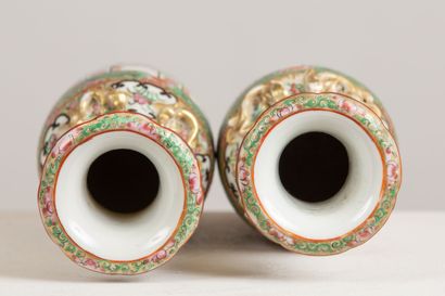 null CHINA, Canton.

Pair of porcelain vases with polychrome decoration of court...
