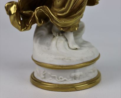 null CAPODIMONTE.

Vestal in white and gold porcelain, holding a bird in her hand....