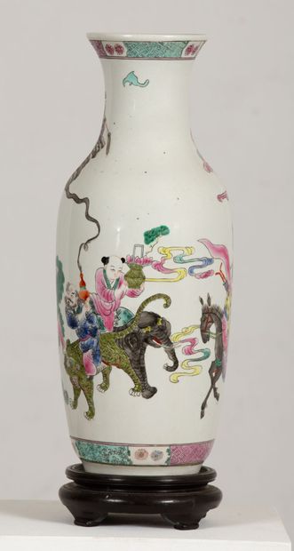null CHINA.

Porcelain vase decorated in the pink family with characters and immortals.

Marked...