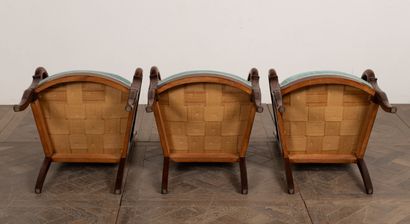 null Suite of three armchairs in molded and carved wood. 

The square back, the armrests...