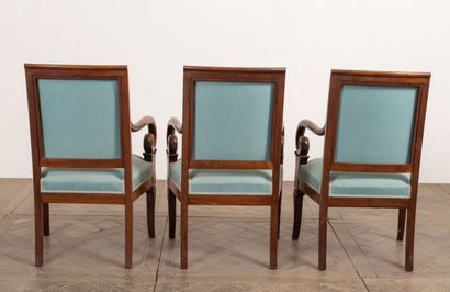 null Suite of three armchairs in molded and carved wood. 

The square back, the armrests...