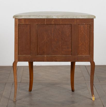 null Marquetry half-moon chest of drawers opening to two drawers. 

Transitional...