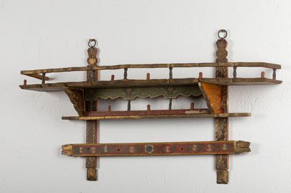 null Hanging shelf in polychrome wood with floral decoration.

Algeria, around 1900.

H_41...