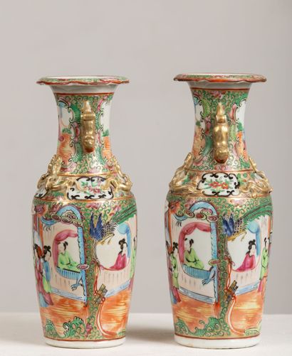 null CHINA, Canton.

Pair of porcelain vases with polychrome decoration of court...