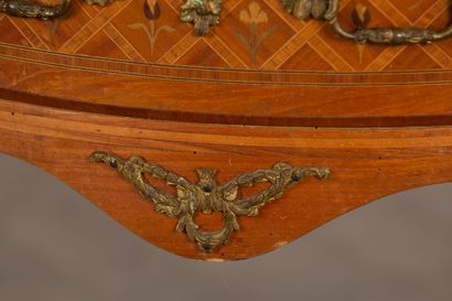 null Marquetry half-moon chest of drawers opening to two drawers. 

Transitional...