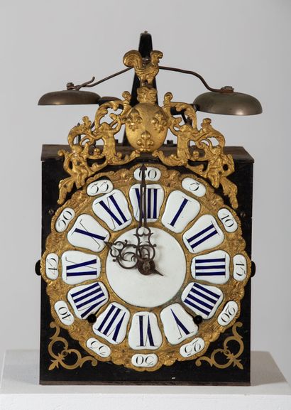 null Comtoise clock, the movement in bronze and enamel cartouches surmounted by the...