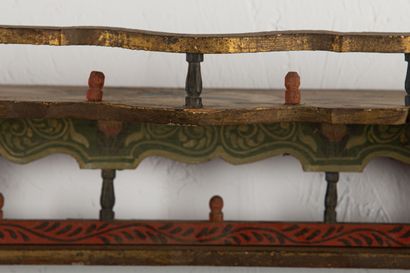 null Hanging shelf in polychrome wood with floral decoration.

Algeria, around 1900.

H_41...