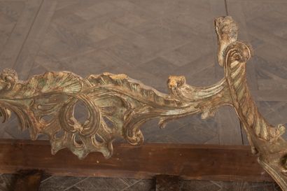 null Unusually low console in carved and openwork wood, formerly lacquered or gilded.

The...