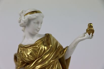 null CAPODIMONTE.

Vestal in white and gold porcelain, holding a bird in her hand....