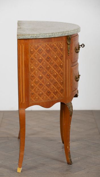 null Marquetry half-moon chest of drawers opening to two drawers. 

Transitional...