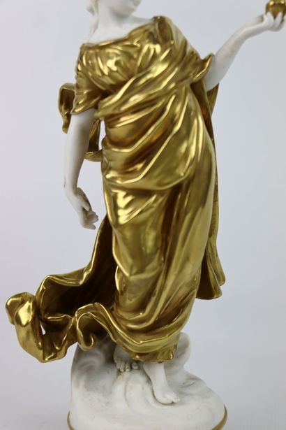 null CAPODIMONTE.

Vestal in white and gold porcelain, holding a bird in her hand....