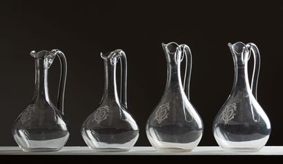 null Suite four crystal pourers, figured.

End of the XIXth century.

H_22,8 cm