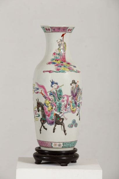 null CHINA.

Porcelain vase decorated in the pink family with characters and immortals.

Marked...