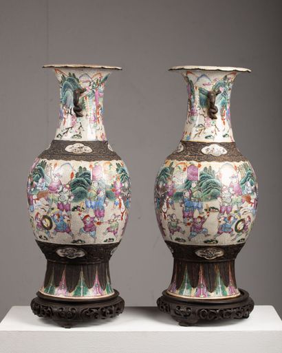 null CHINA, Nanjing

Pair of large ceramic vases with polychrome decoration of battle...