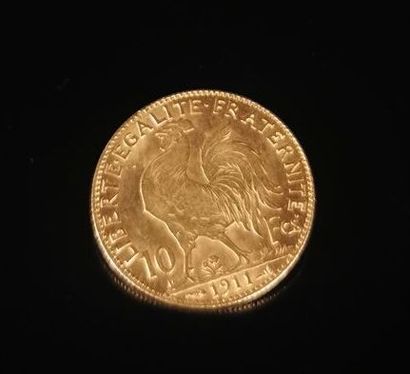 null 10 francs gold coin with rooster.

1911.

3.24 grams