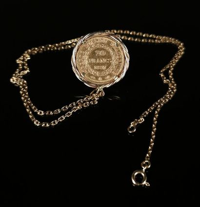 null Yellow gold necklace with forçat link, holding a pendant adorned with a 20 francs...