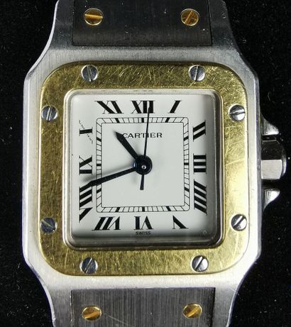 null CARTIER.

Ladies' wristwatch, Santos model, in yellow gold and steel.

White...