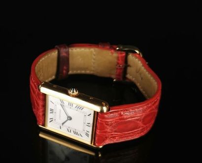null CARTIER.

Ladies' wristwatch, Tank model, gold case, red leather strap and black...