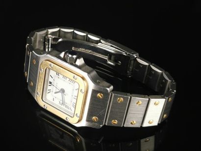 null CARTIER.

Ladies' wristwatch, Santos model, in yellow gold and steel.

White...
