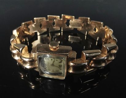 null MP. 

Lady's wrist watch with yellow gold case and bracelet.

Functional movement,...