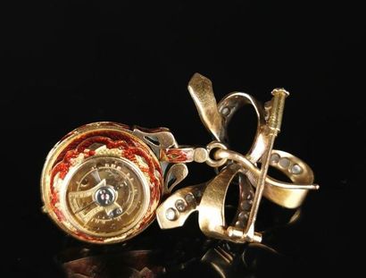 null Watch called "boule de Genève" in yellow gold enamelled red and set with diamonds....