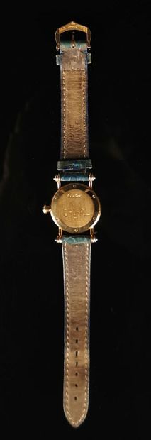 null CARTIER, Paris.

Yellow gold ladies' wristwatch, decorated with five sapphire...