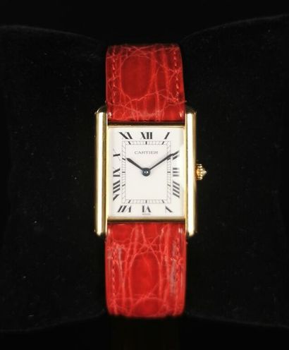 null CARTIER.

Ladies' wristwatch, Tank model, gold case, red leather strap and black...