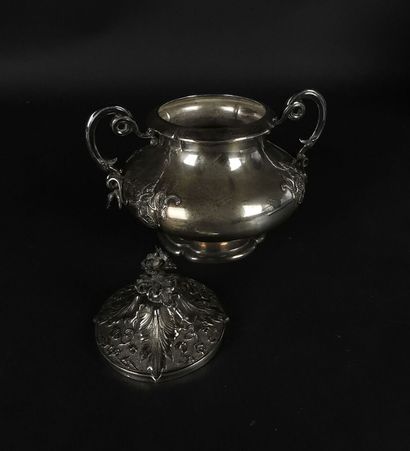 null Coffee pot and its covered sugar bowl in silver with rich plant decoration....