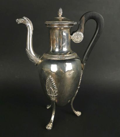 null Silver tripod pourer decorated with palmette friezes, the zoomorphic spout.
The...