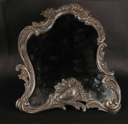 null Silver table mirror with rocaille decoration.
Alphonse DEBAIN, master goldsmith,...